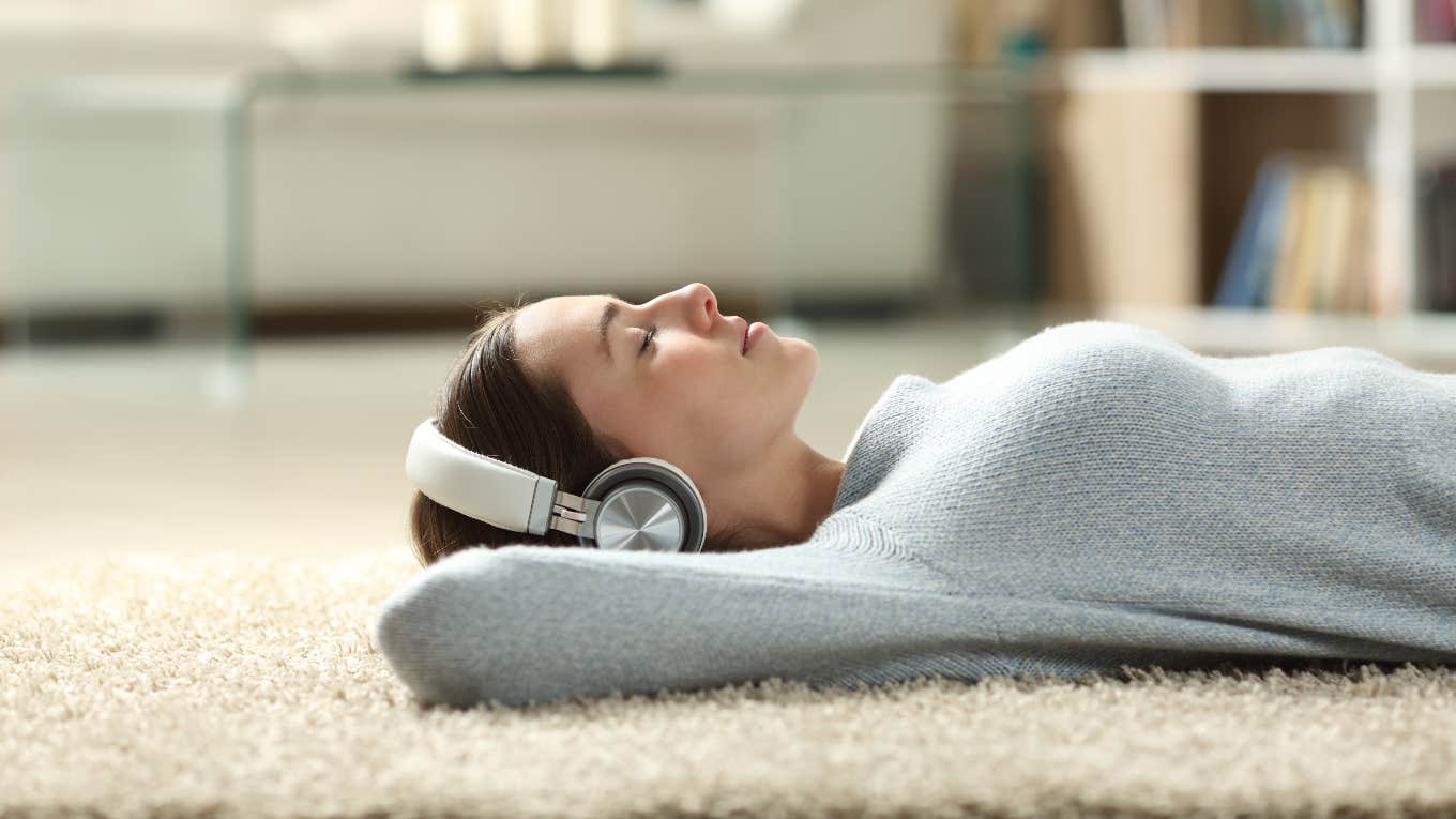 Woman listening to music to protect her brain