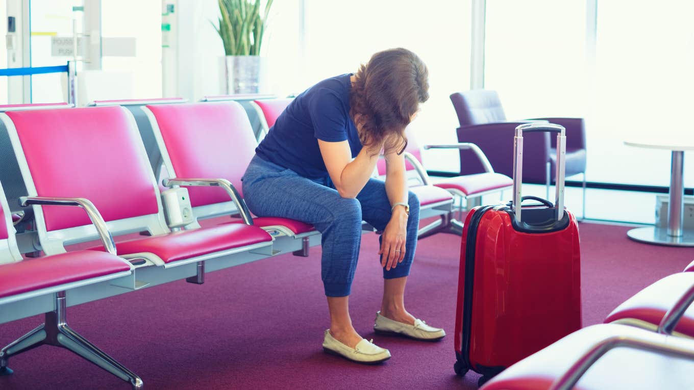 woman angry after being denied boarding her airplane flight