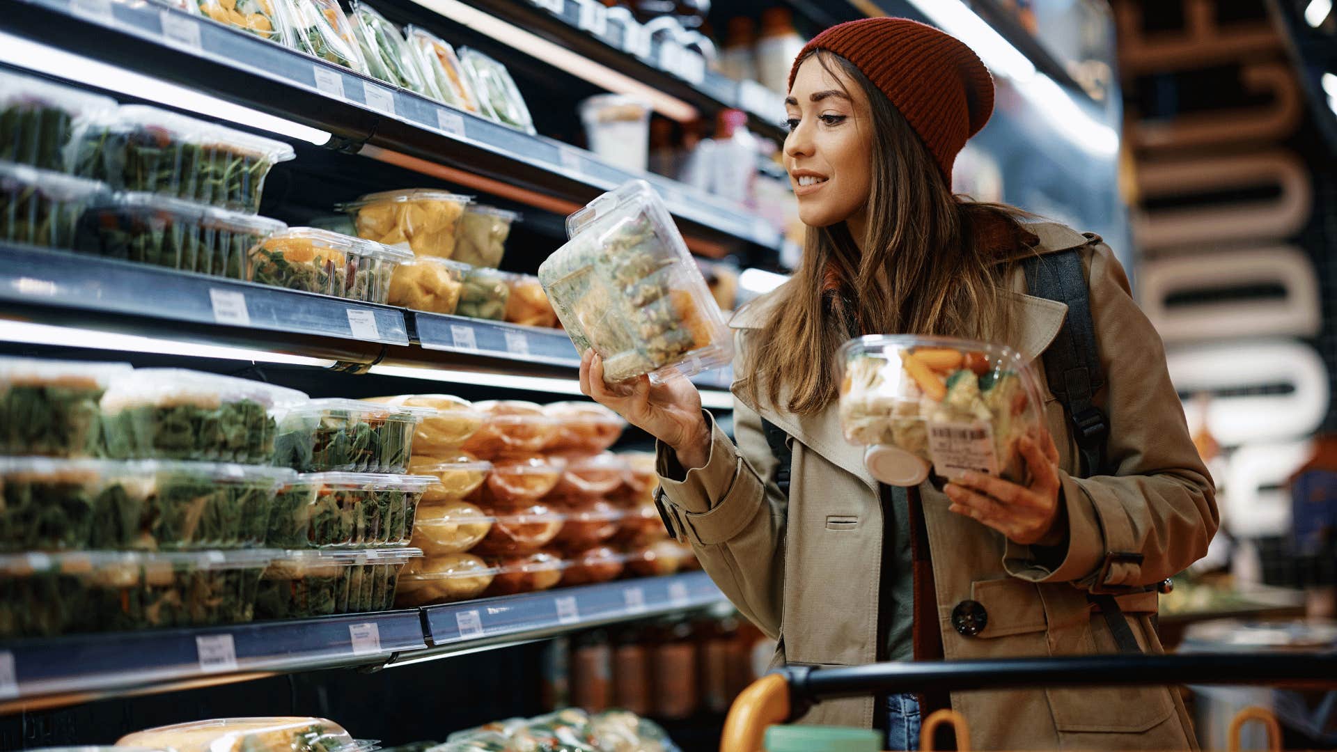 woman being frugal and looking at price tags