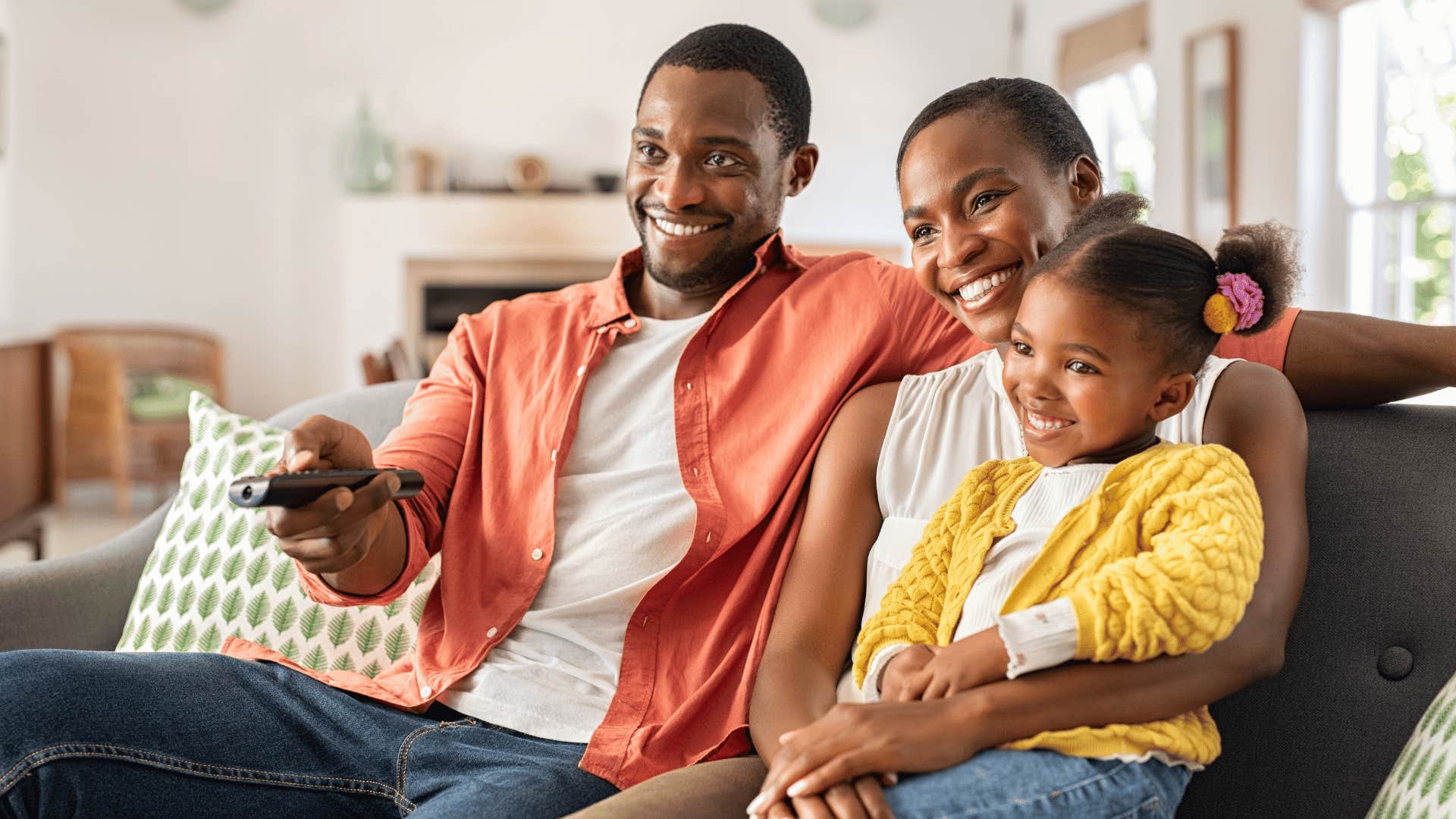 family being frugal and watching tv at home