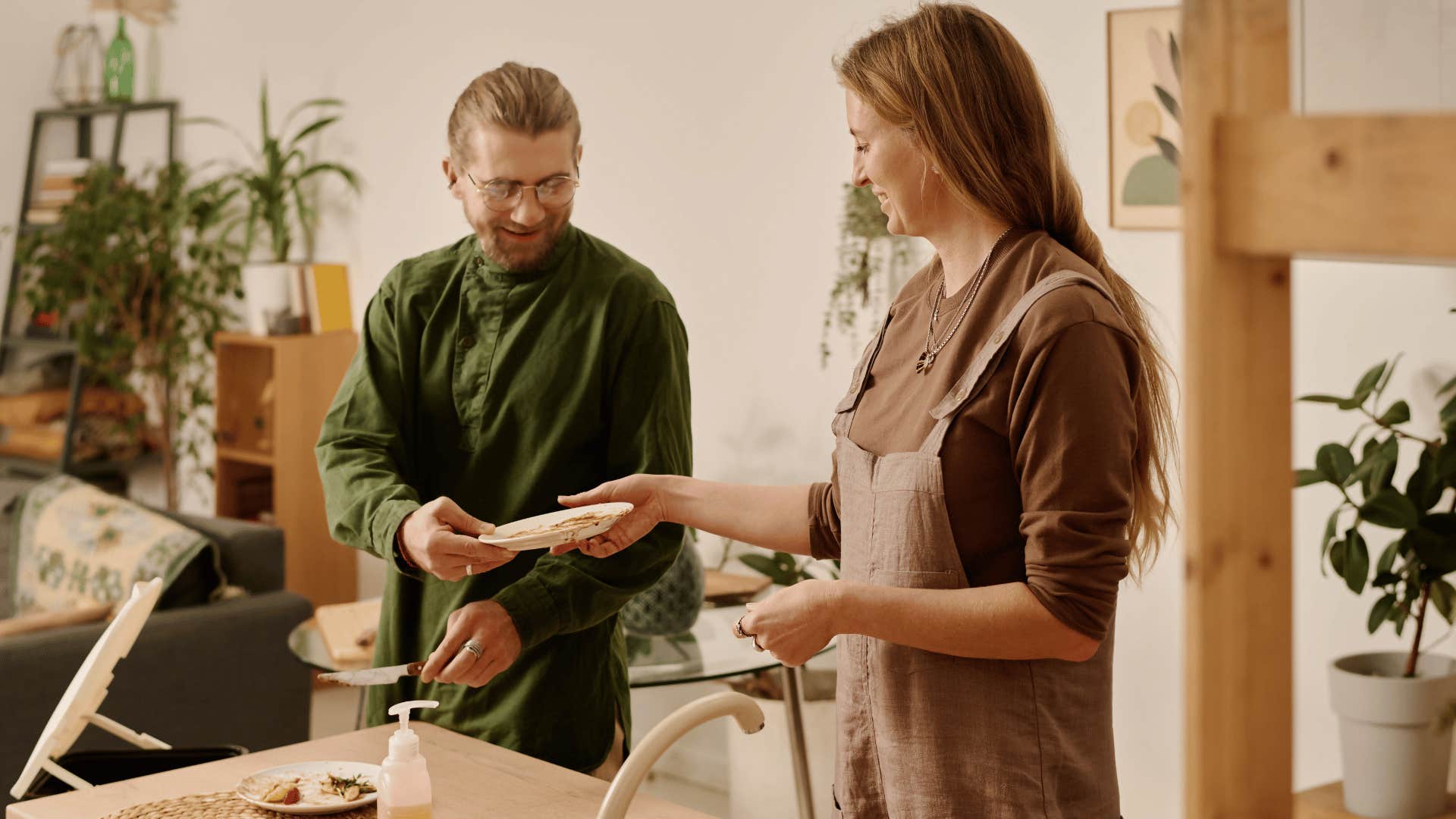 couple doing dishes old-fashion way