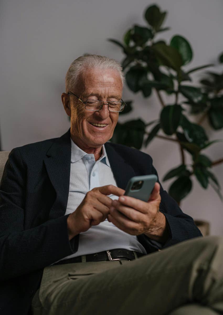 elderly man using phone