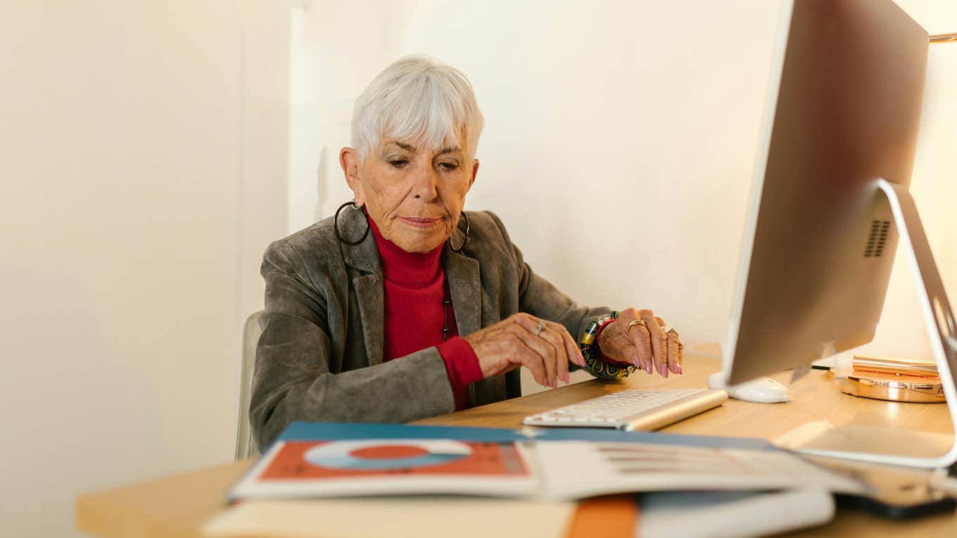 Older employee working at desk