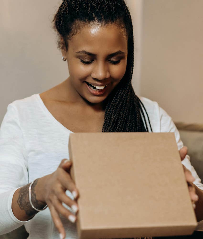 woman opening a box