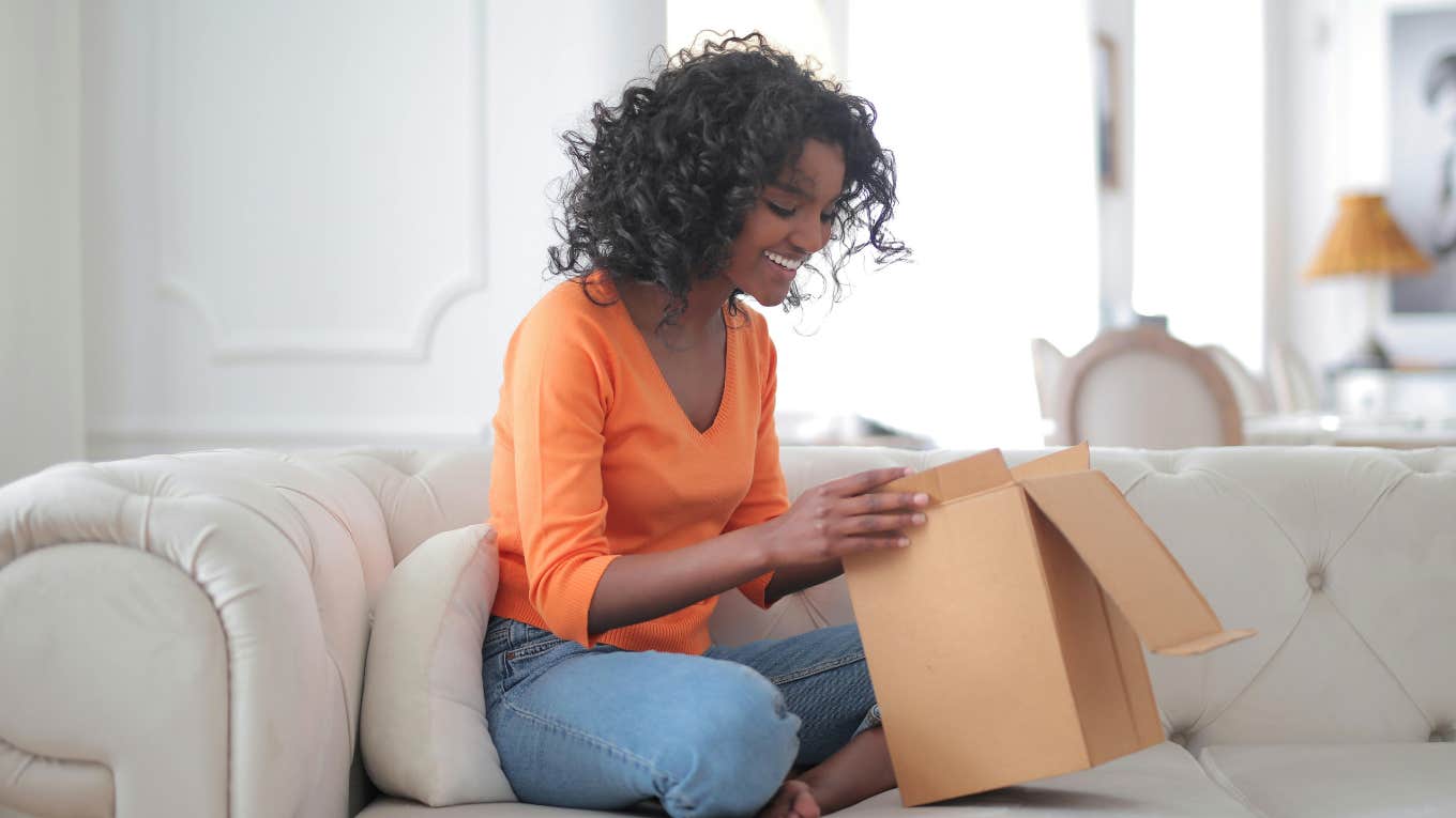 woman opening a box