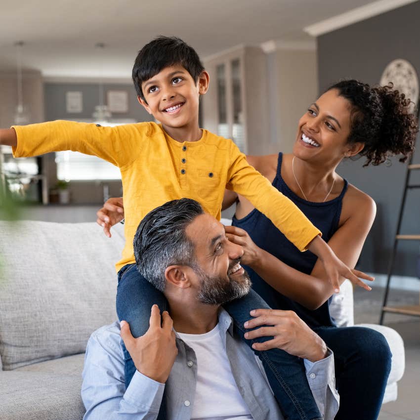 Parents play with their young favorite child. 