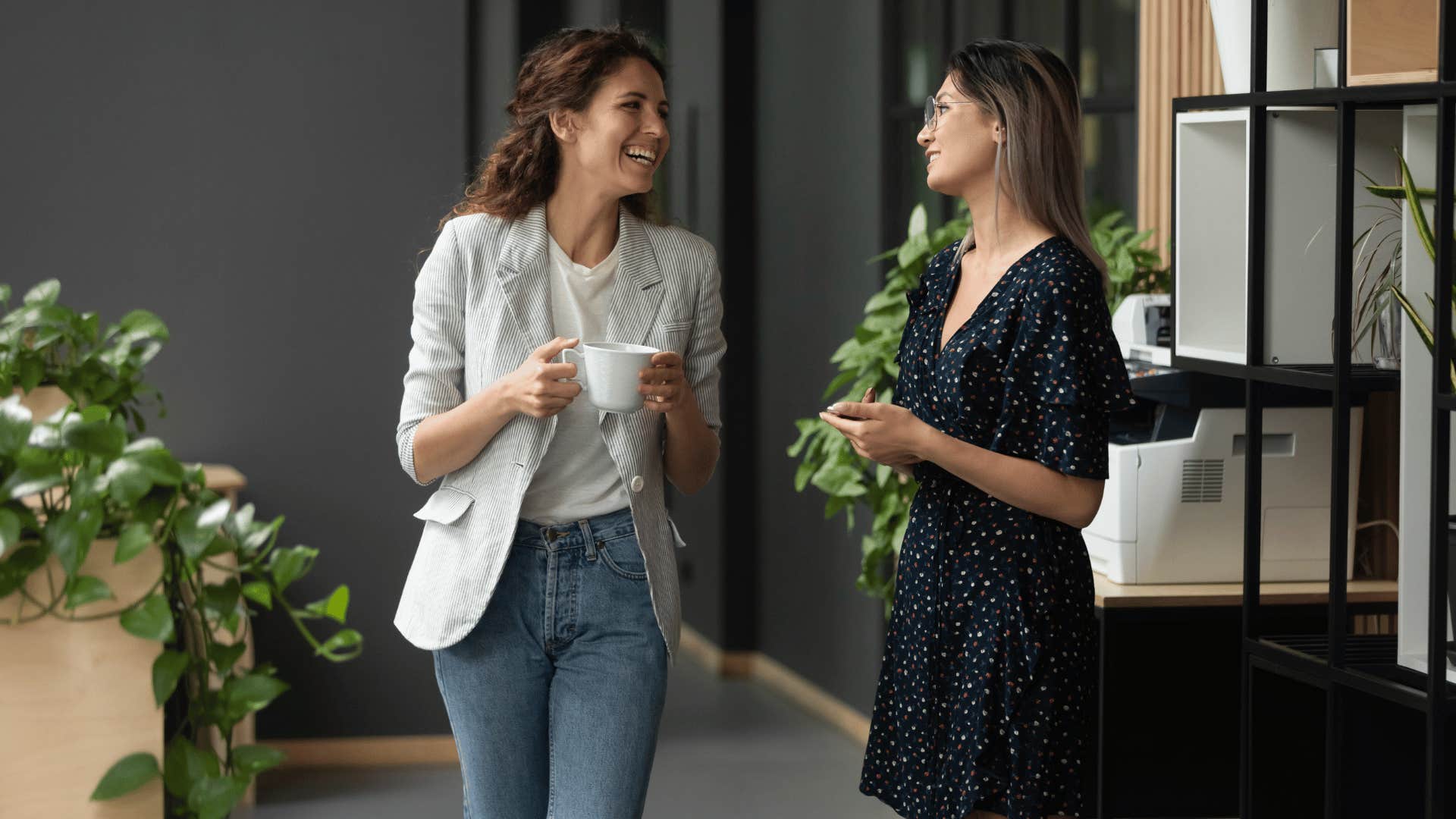 intelligent woman walking and talking to other woman