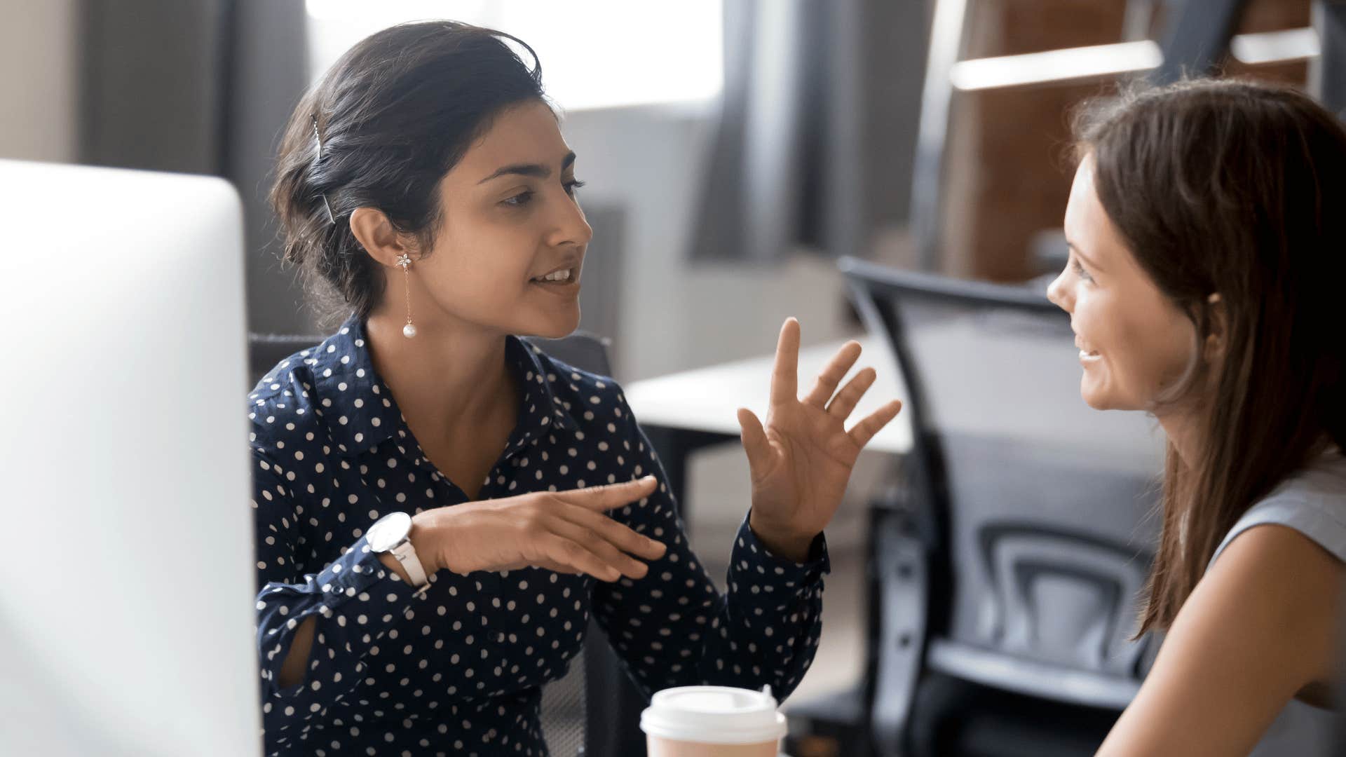 intelligent woman talking to other woman