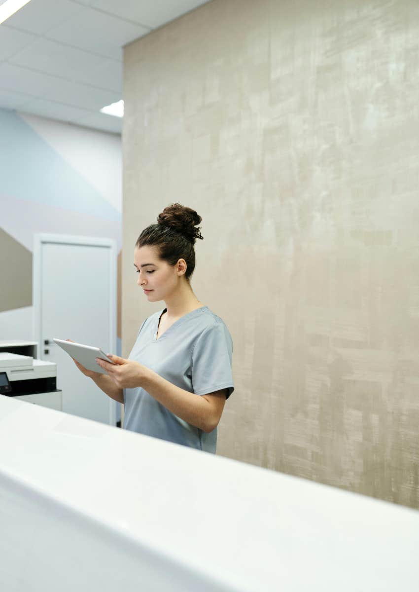 nurse at reception desk at medical office