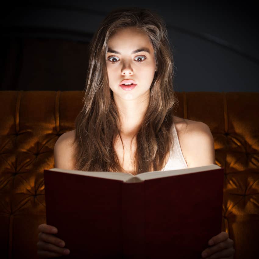 woman reading a red book