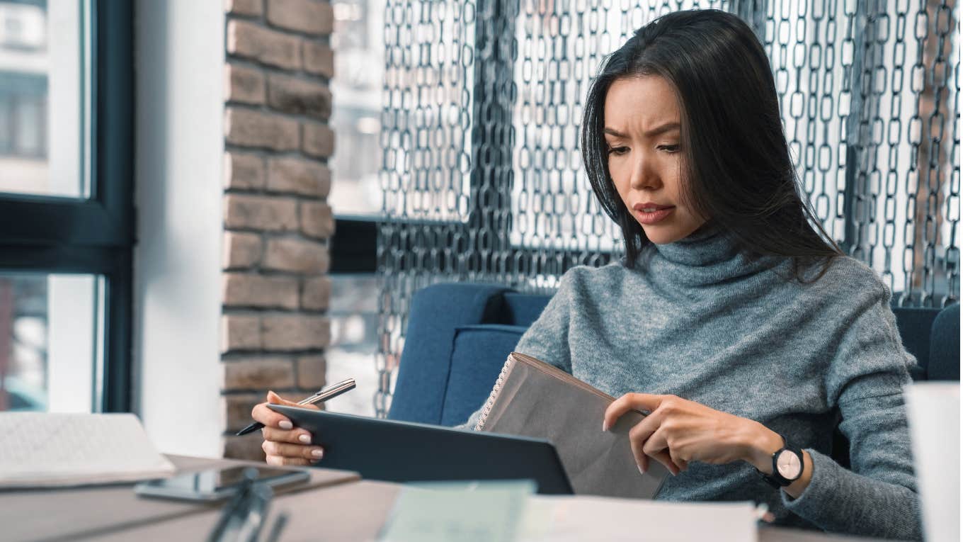 CEO reviewing a resume looking confused. 