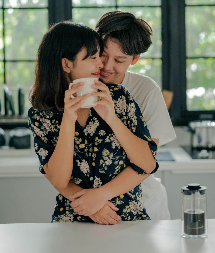 couple hugging in kitchen 