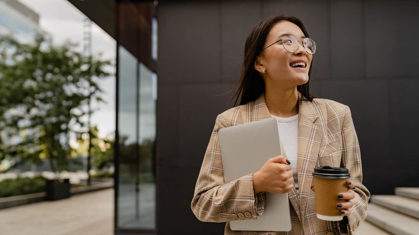 female employee holding coffee