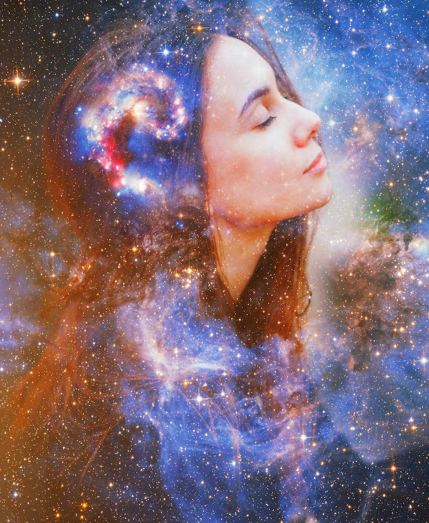 Double image of woman's profile against galaxies as symbolic of guidance from spirits