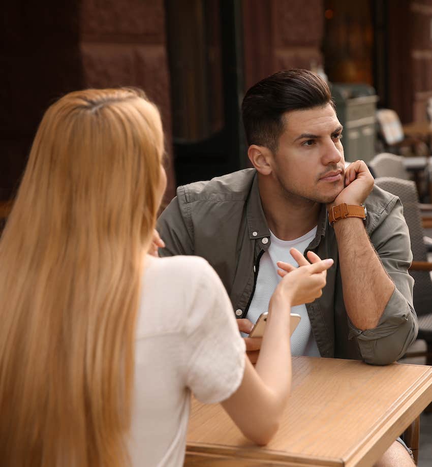 He ignores her on a date because she likes him way more