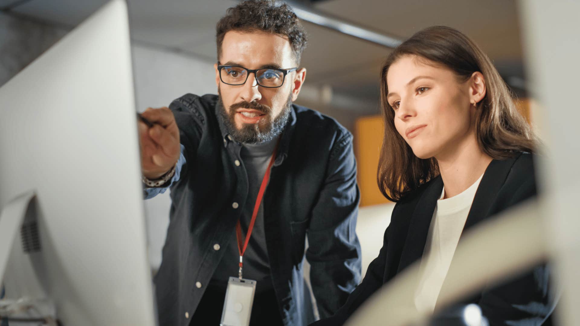 man helping woman solve problem