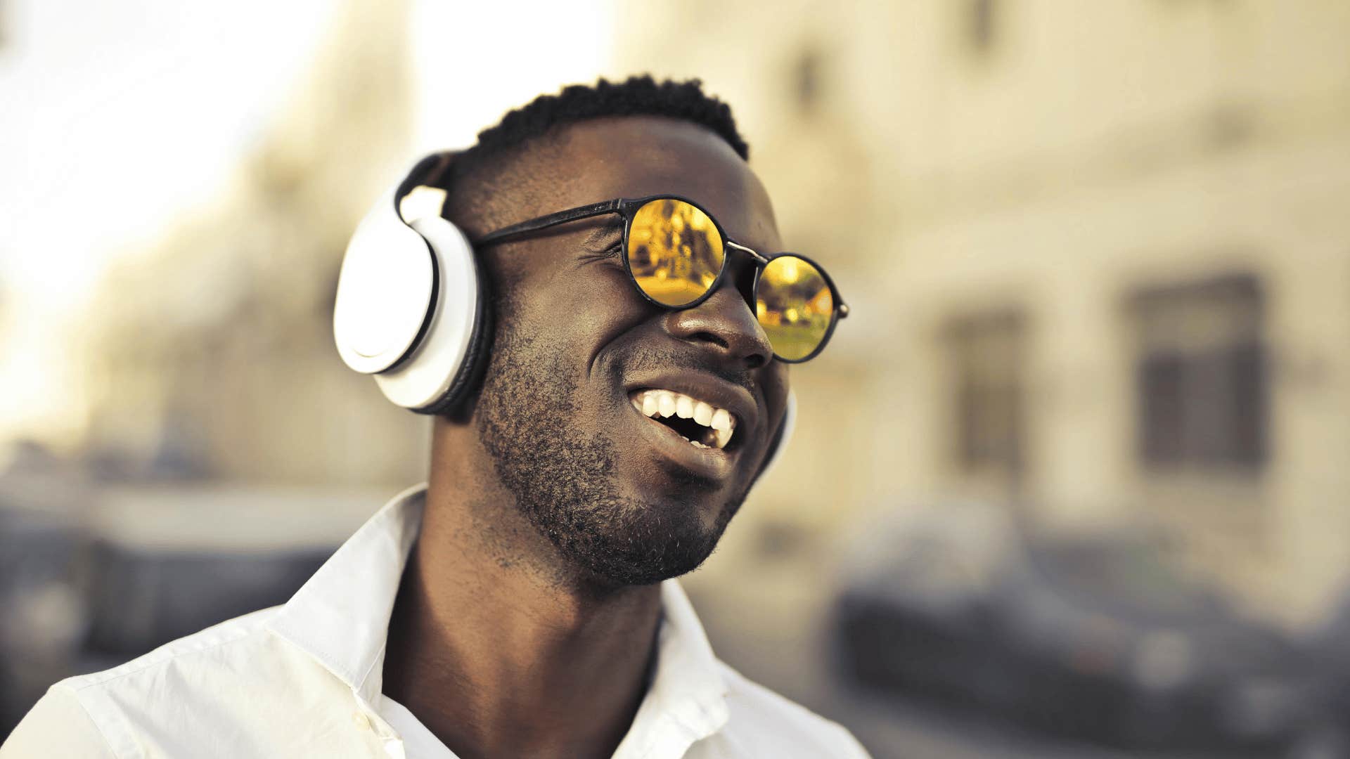 happy man focusing on the present wearing headphones