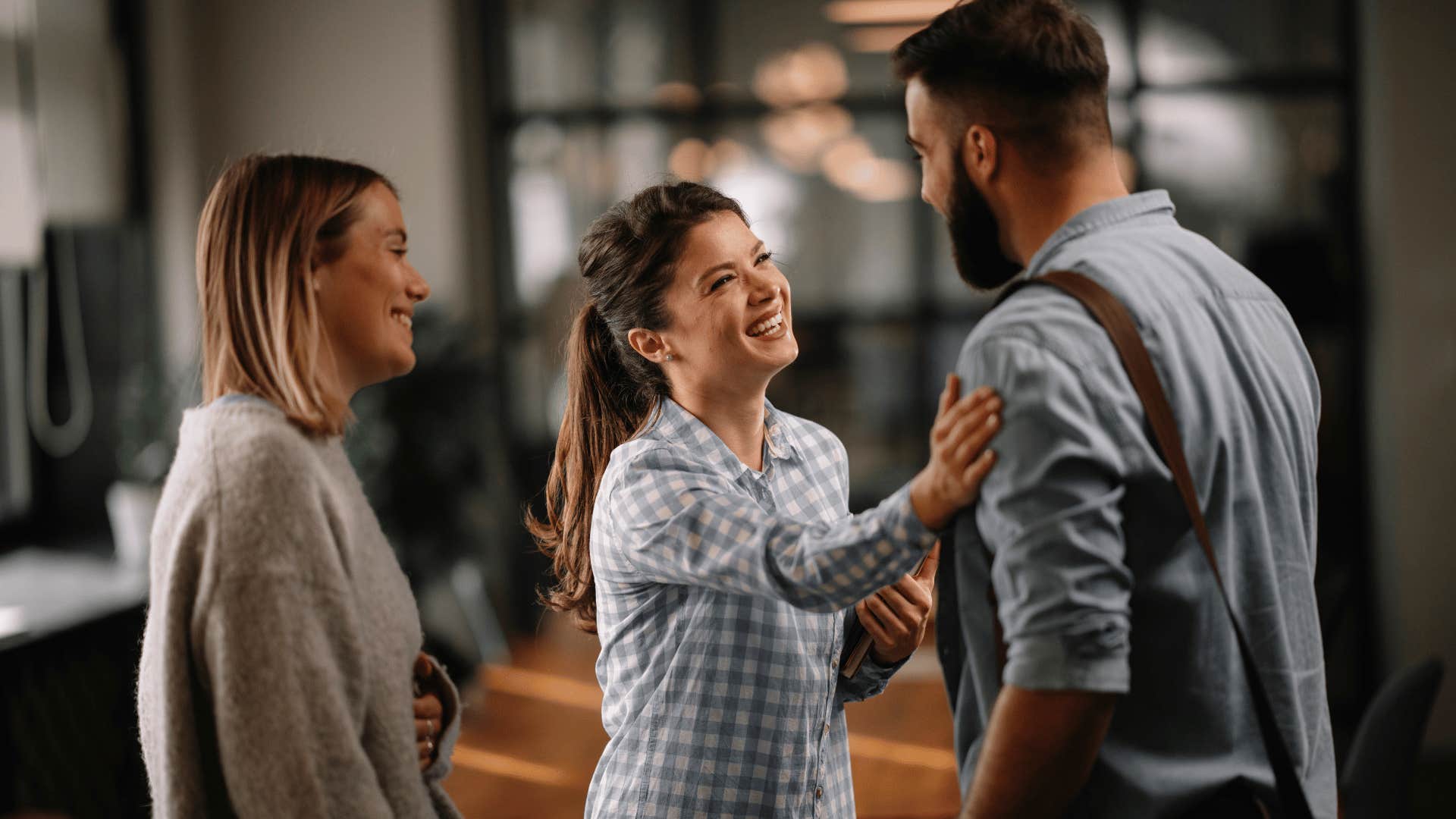 woman touching man shoulder