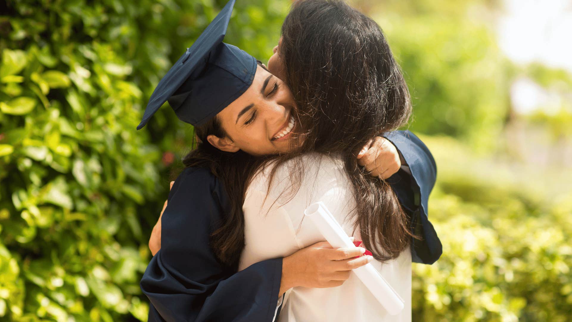 daughter accomplishing goals hugging mother