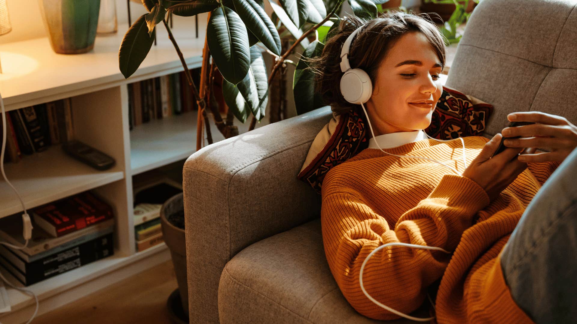 woman listening to subliminals