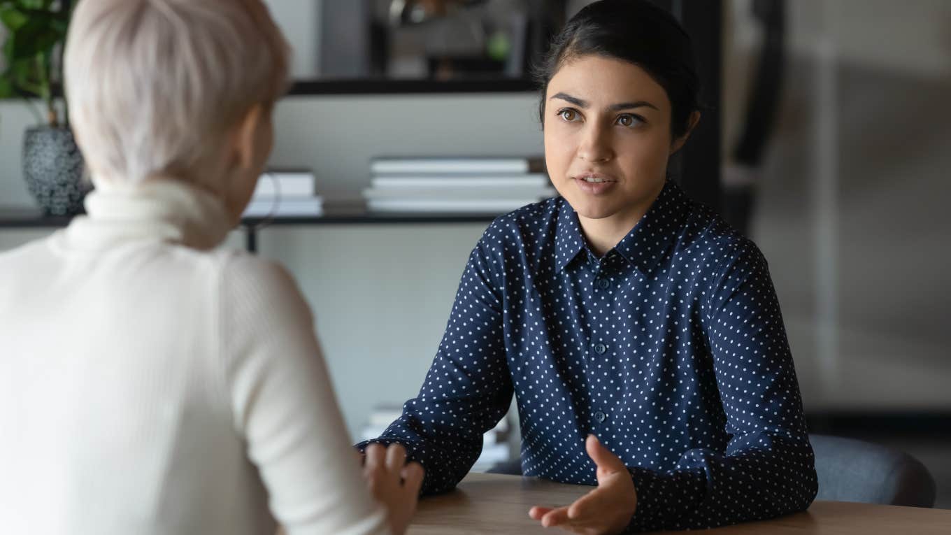 two women having a conversation at work