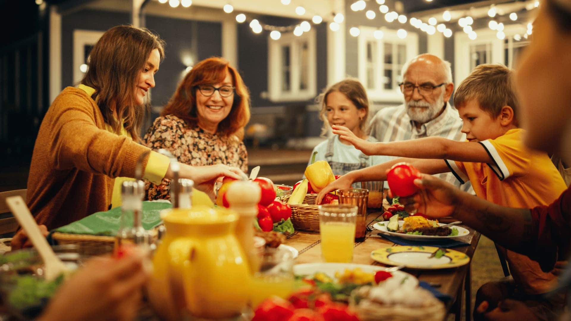 people eating dinner together laughing