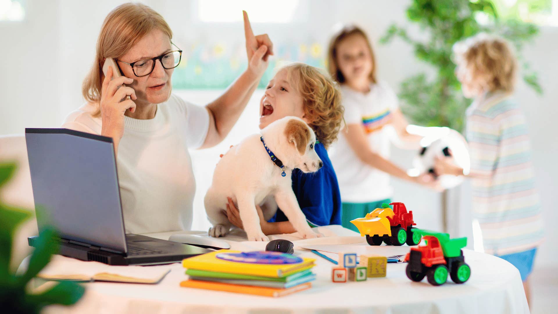 exhausted mother dealing with kids and work