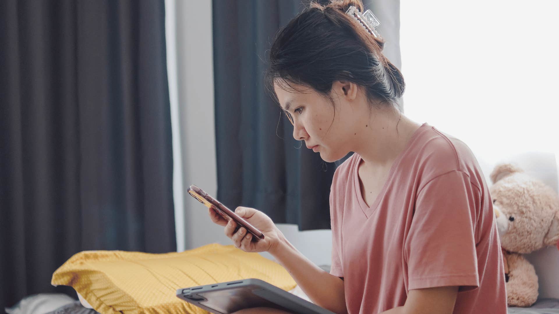 introverted woman looking at phone