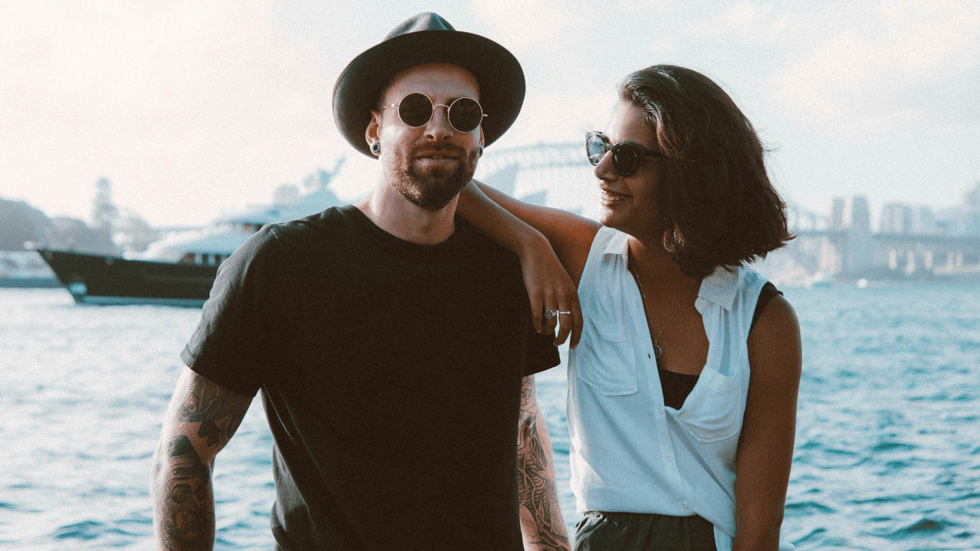 couple by the water with woman being empathetic