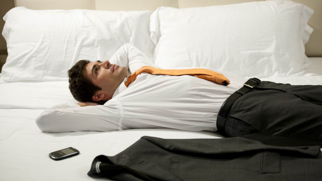 man lying down on bed