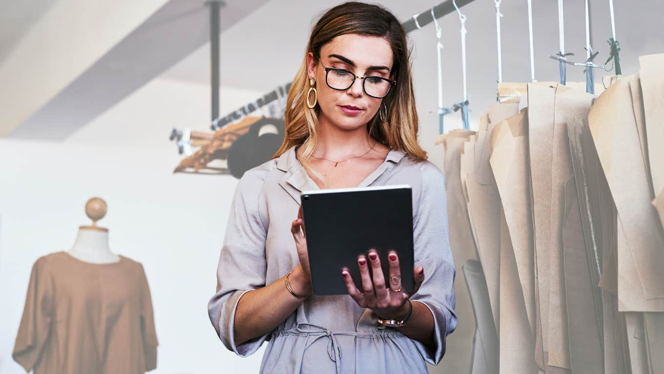 Boss reviewing work clothes on a tablet.