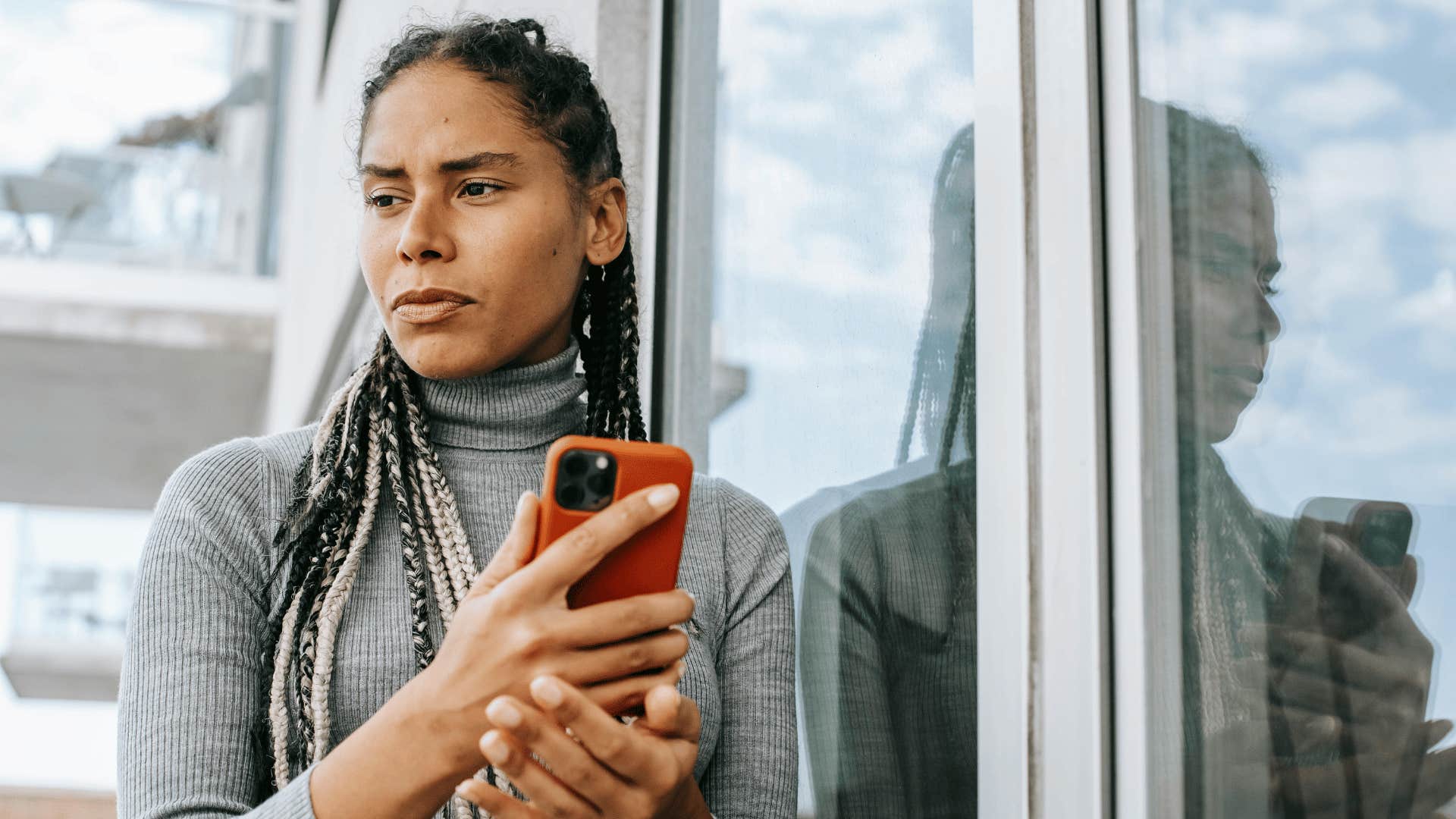 mentally strong authentic woman looking at phone