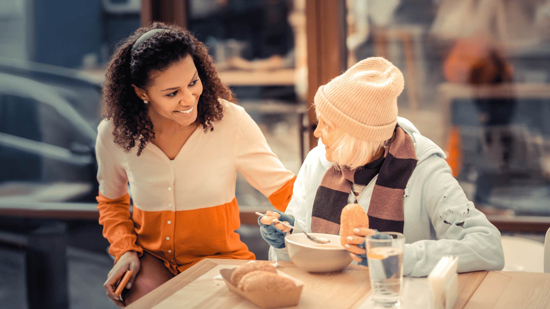 kind woman being nonjudgemental and helping other woman out