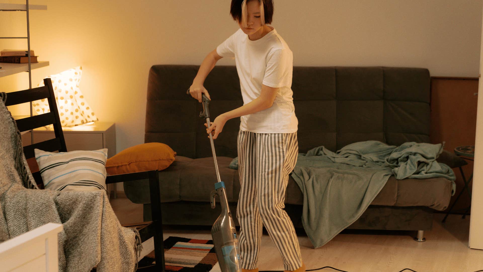 type A person vacuuming the floor