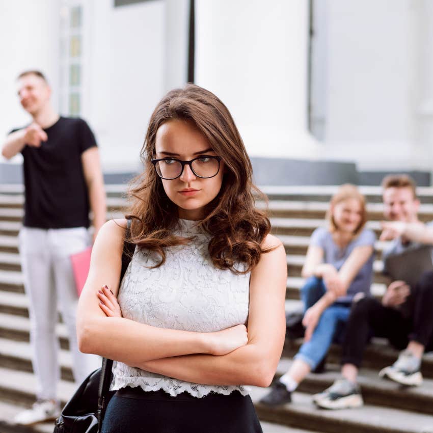 upset woman people pointing at her laughing mean jokes