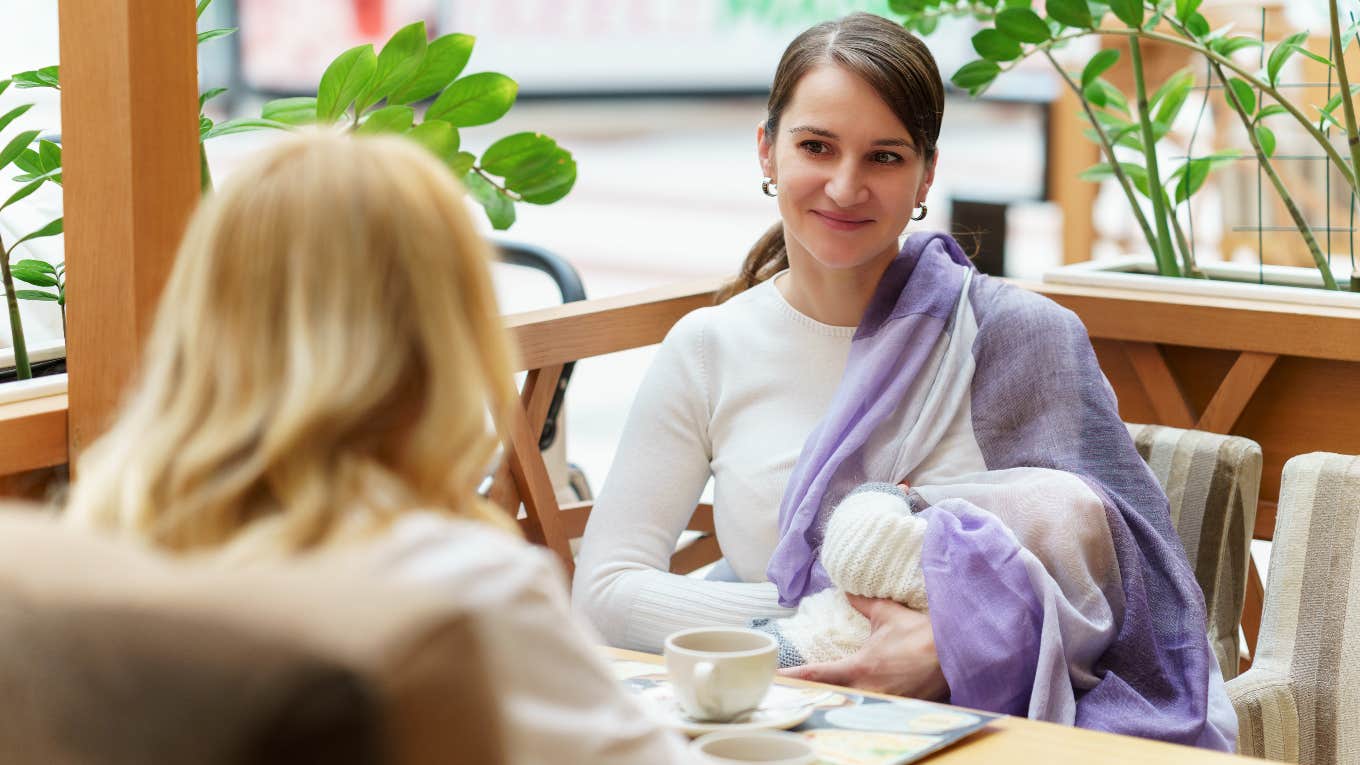 Mom breastfeeding at restaurant