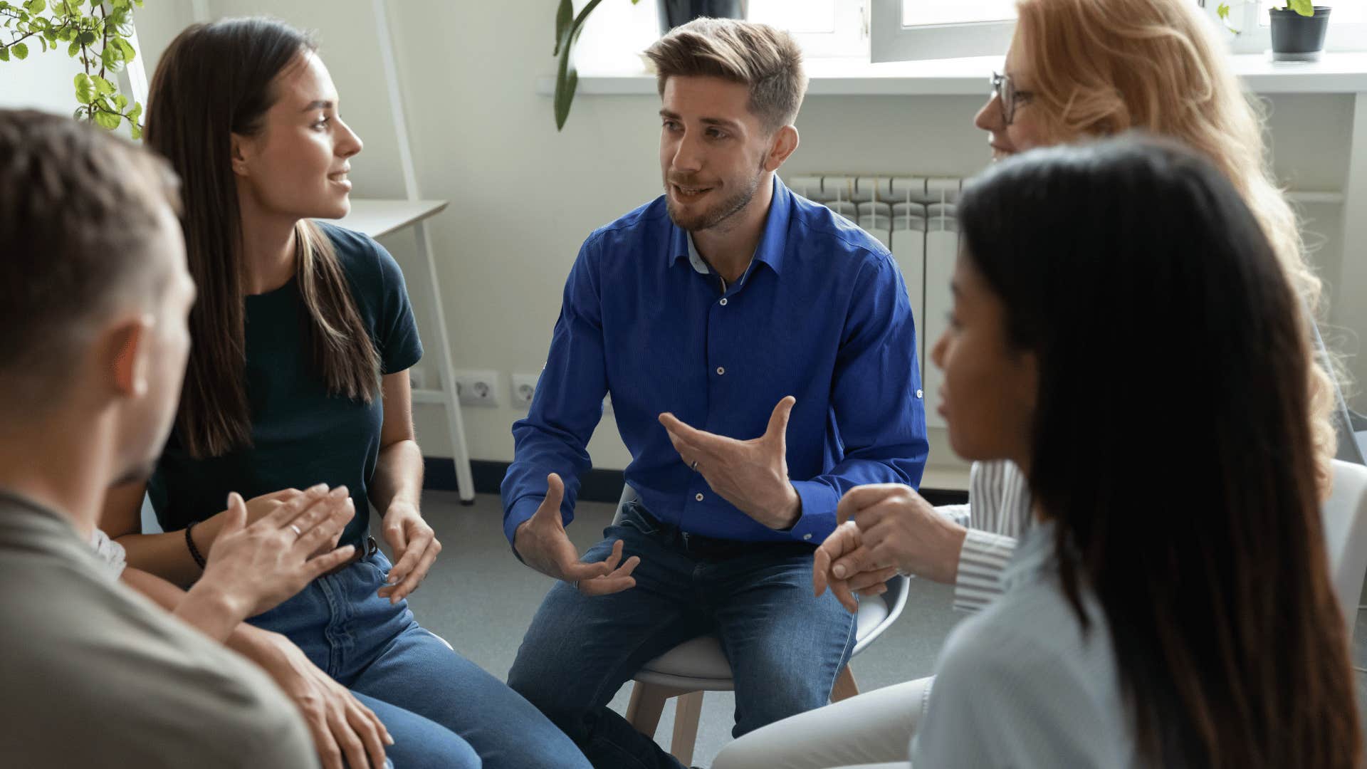 man talking and managing team