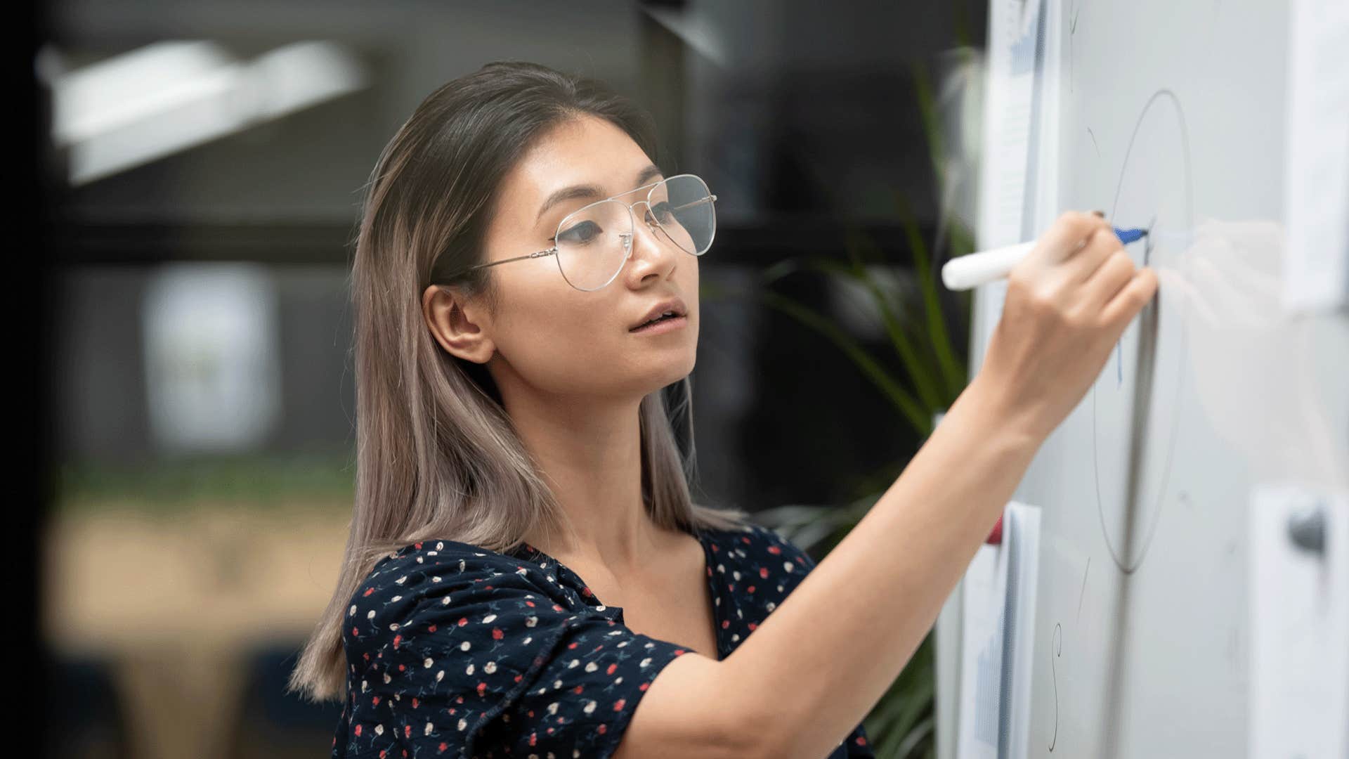 woman being detailed in writing and showing off her intelligence