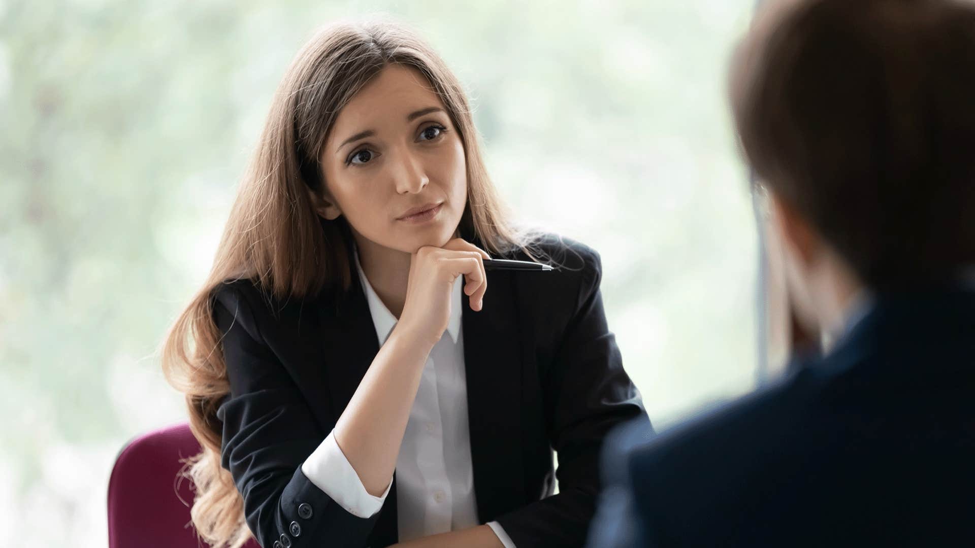 woman looking empathetically at a man showing emotional intelligence without a word