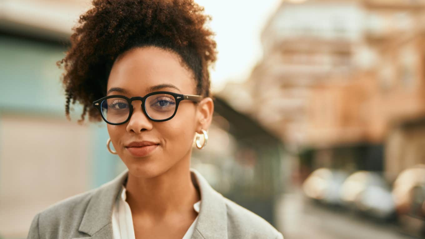 intelligent woman smiling wearing glasses