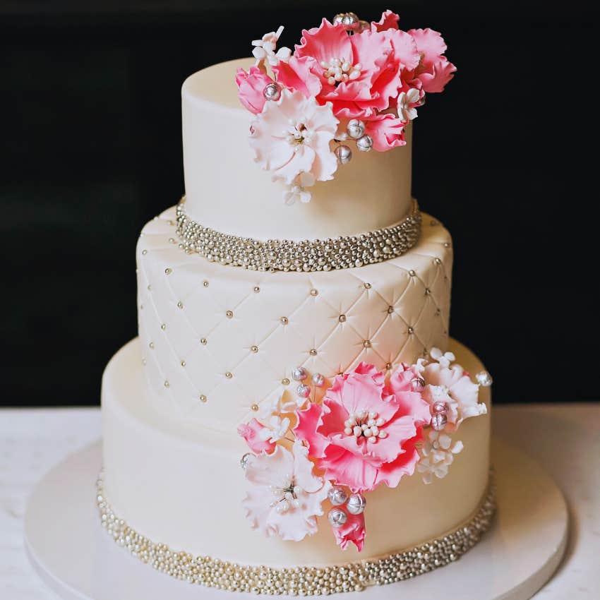 traditional wedding cake with pink flowers