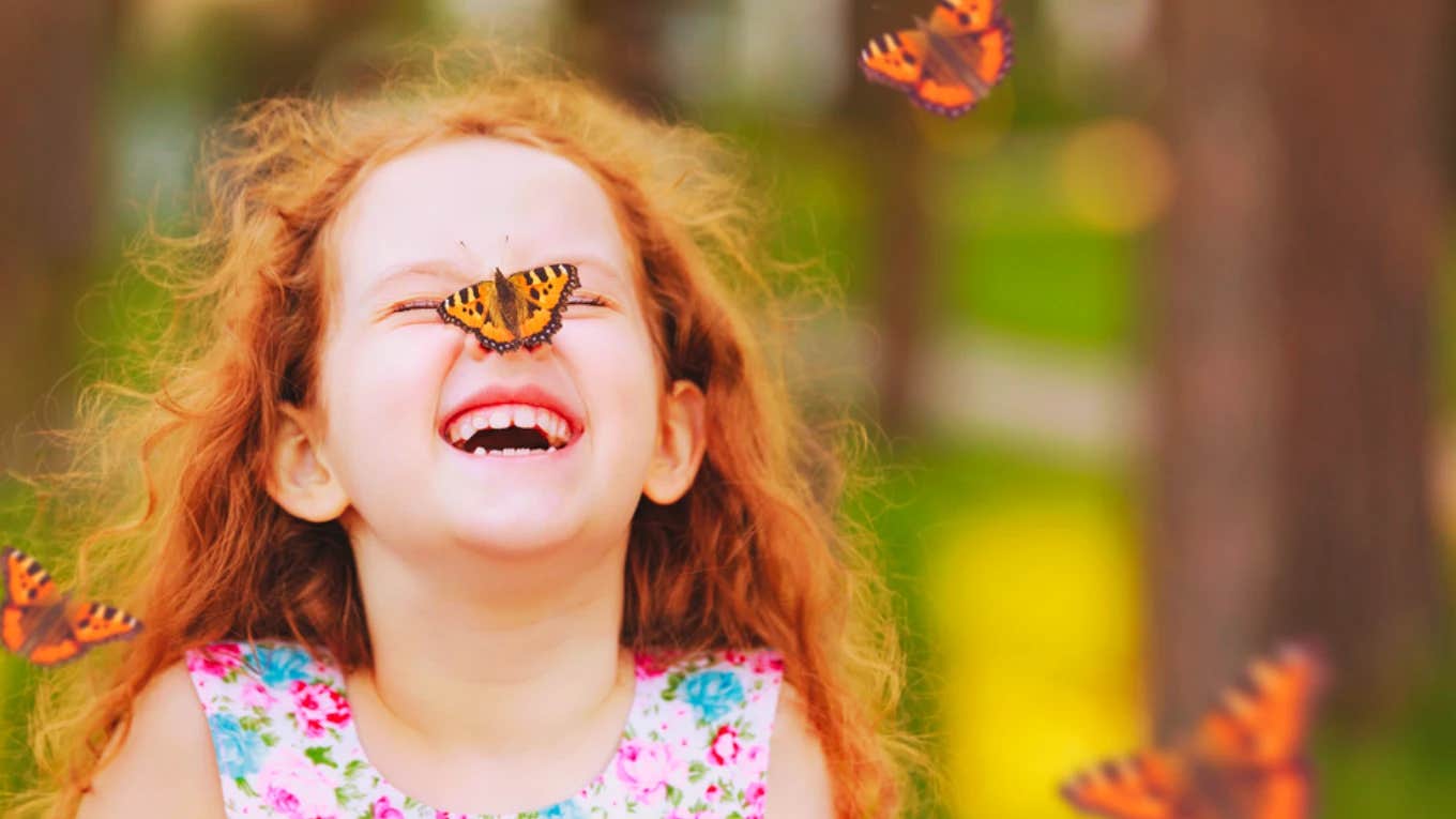 Little girl with butterfly