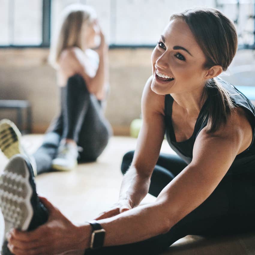 Woman stretching before working out. 