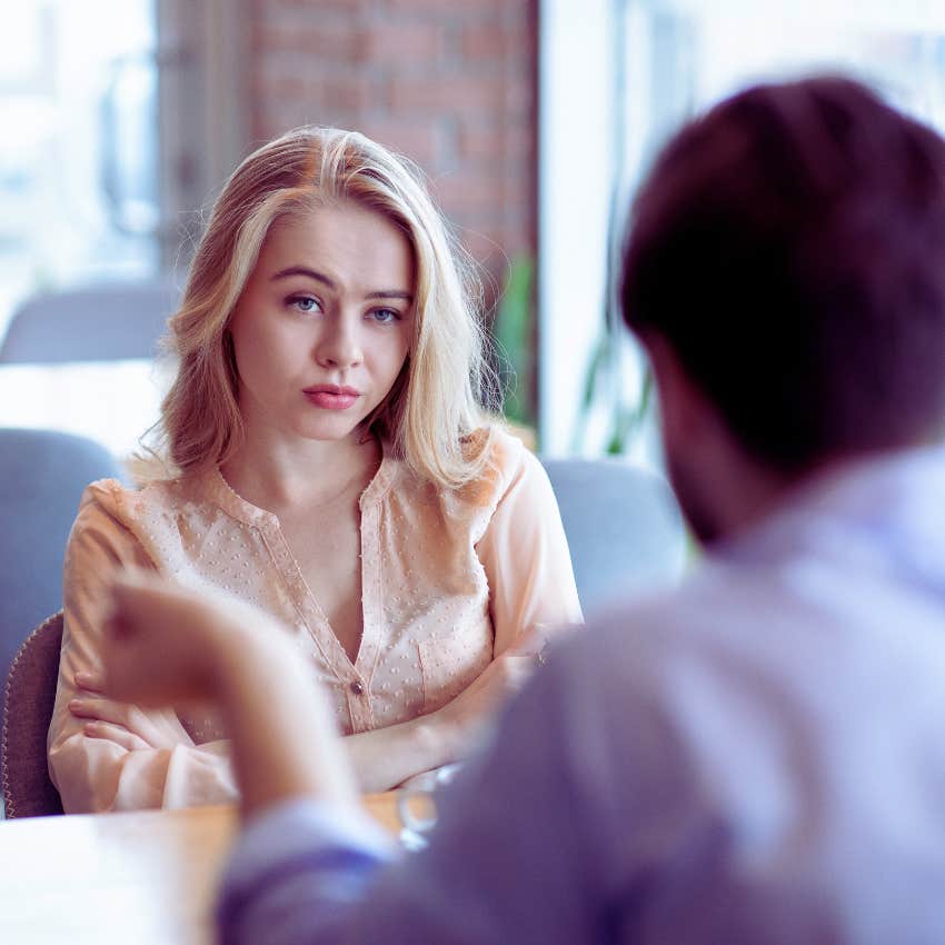 blonde woman with annoyed expression while listening to her date