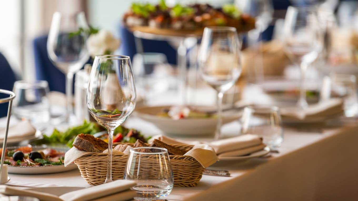 place settings at a wedding reception with wine glasses