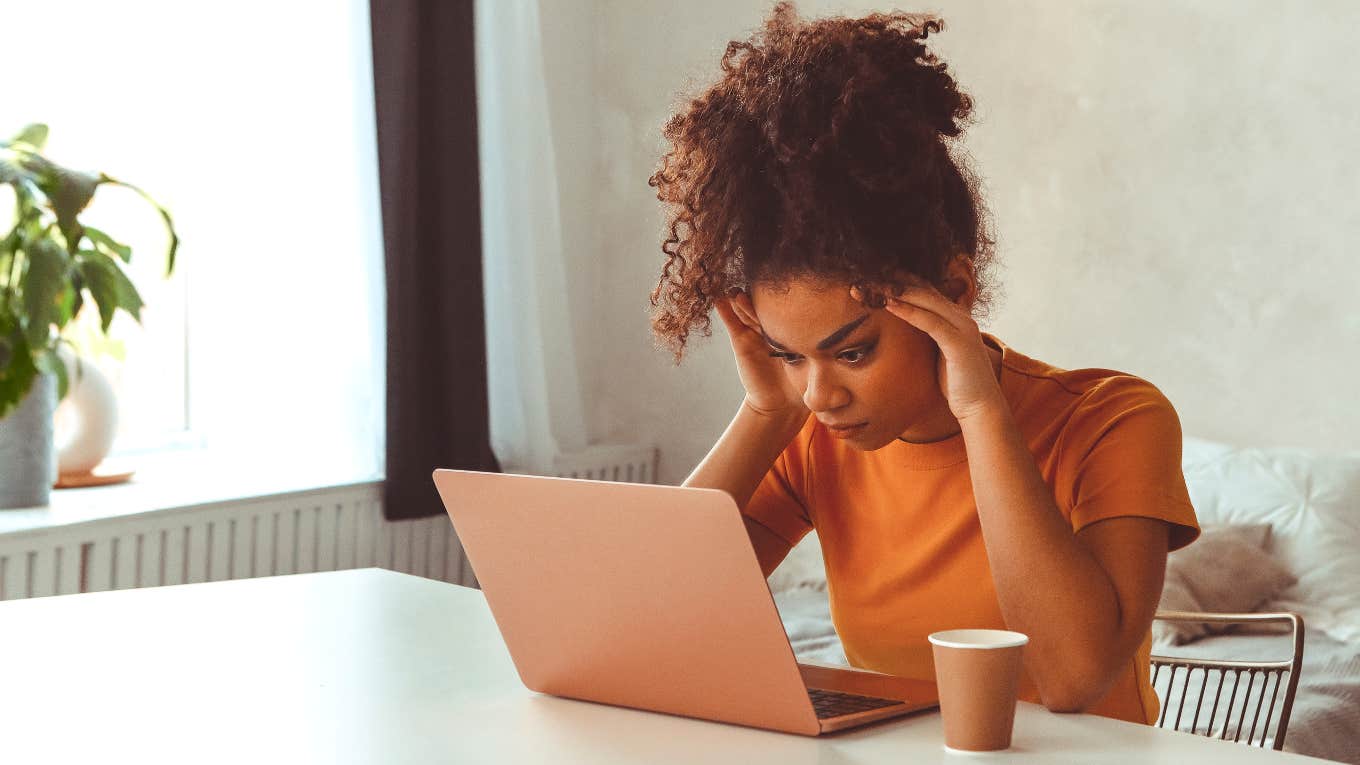 Flabbergasted woman reading email and learning how much her landlord wanted to increase her rent