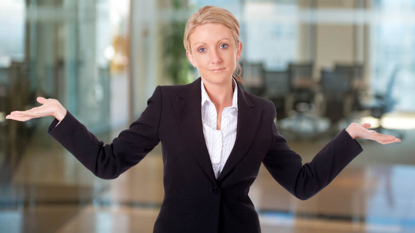 woman shrugging about having lied on her resume