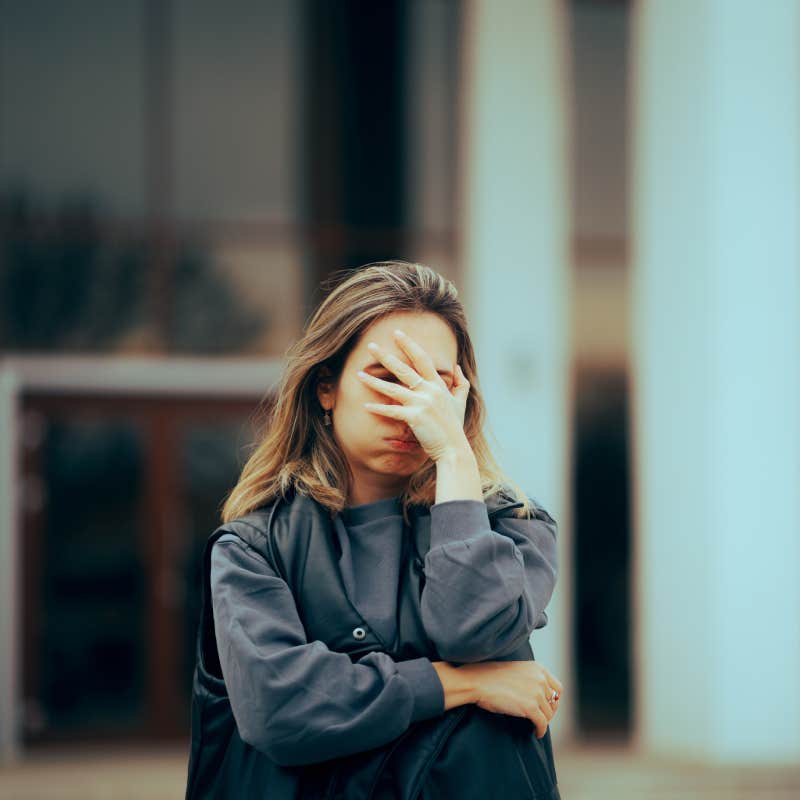 Woman Making Facepalm Gesture Waiting Outside