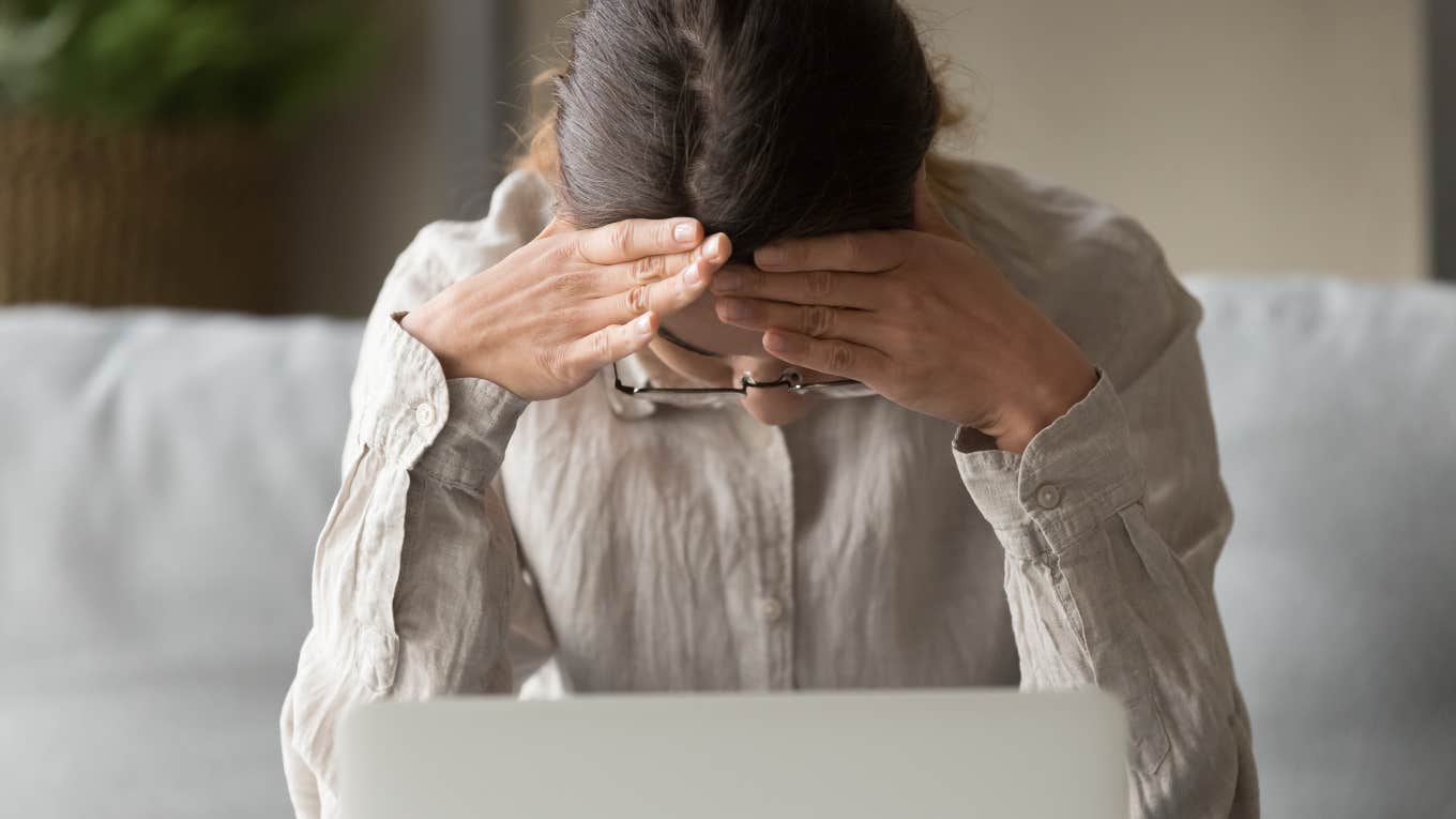 sad business woman sitting in front of computer