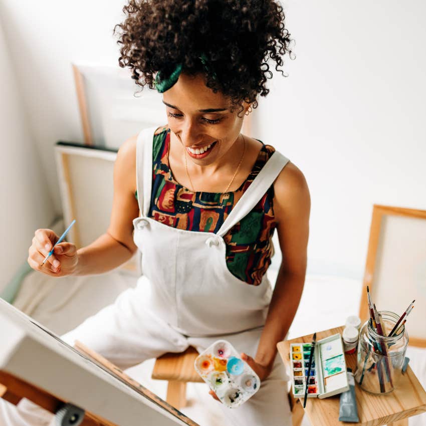 Post office worker doing art at home. 